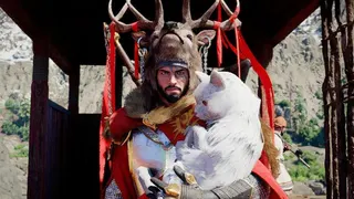 Kliff from Crimson Desert in a large stag like headdress holding a white creature in his arms